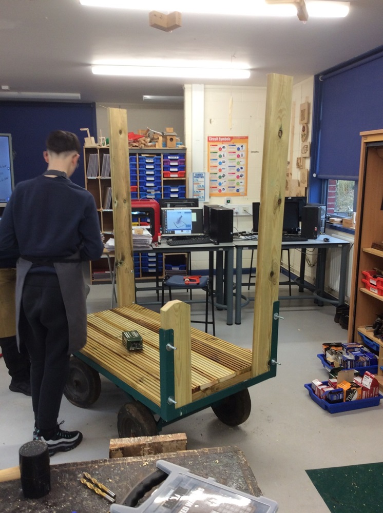 Pupil working on the market stall structure