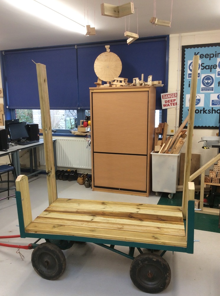 pupils begin to build up the trolley with wooden slats