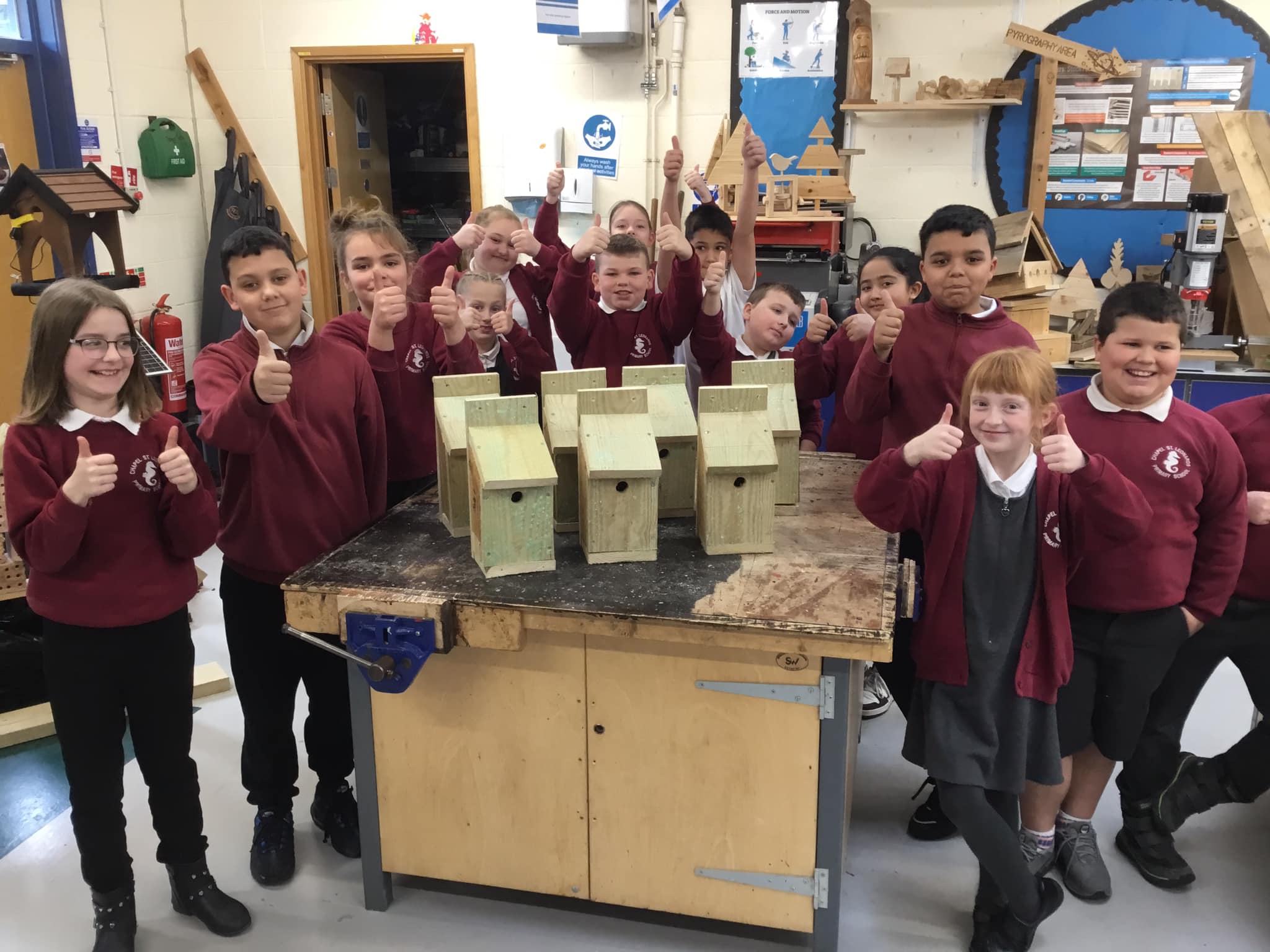 the Chapel pupils show off their hand made bird boxes